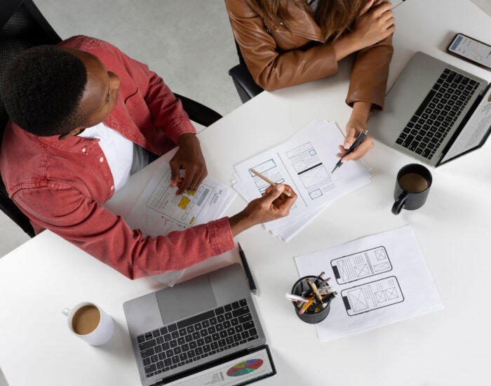 top-view-people-working-with-laptops